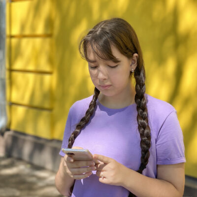Teenage girl using smartphone.
