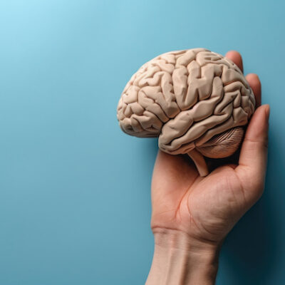 A man holding a brain concept image.