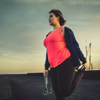 Woman exercising in the early evening.