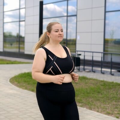 Woman with overweight jogging.