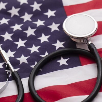 US flag and a stethoscope.